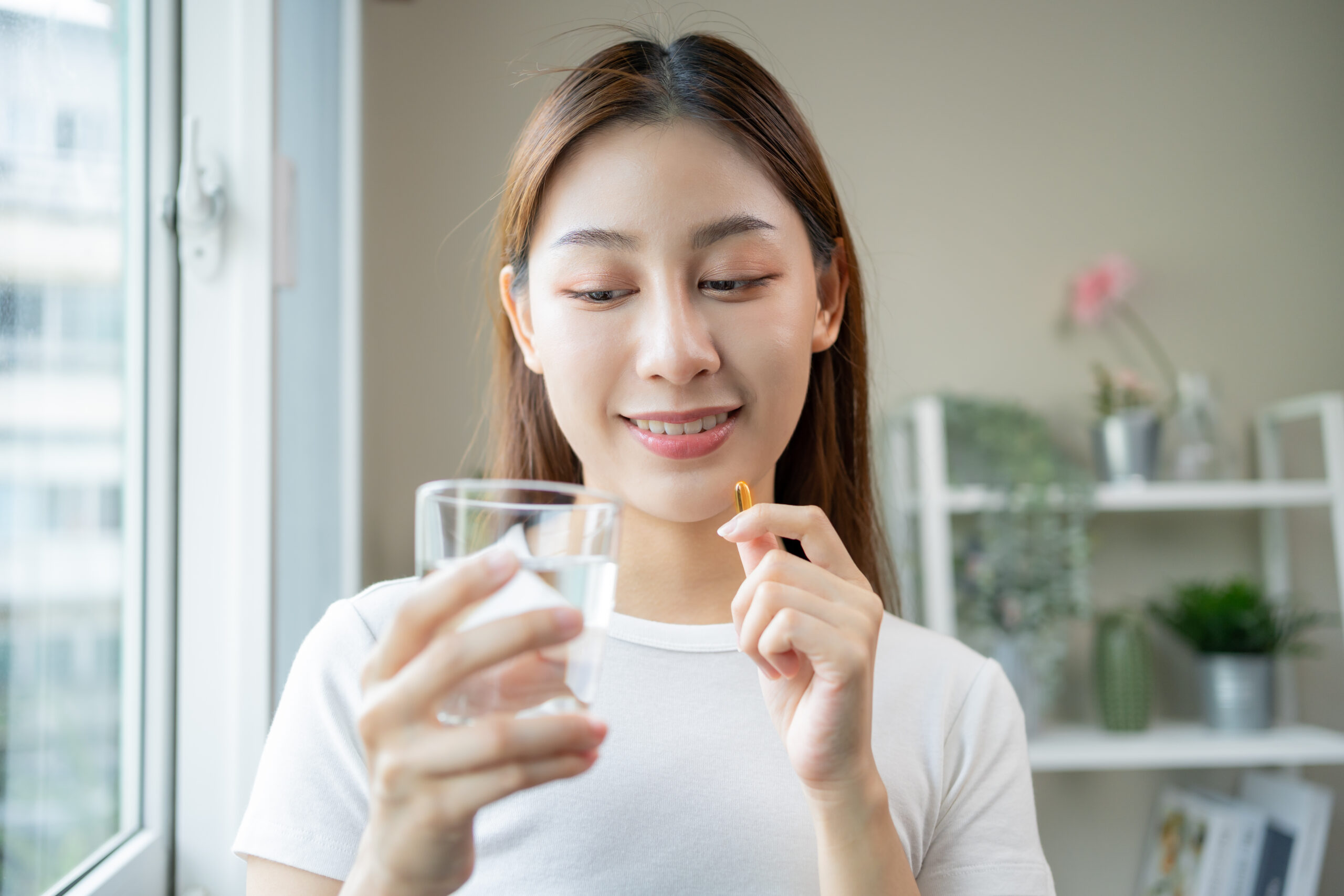 woman taking a dietary supplement