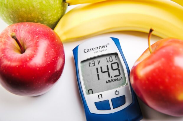 blood sugar meter and fruit