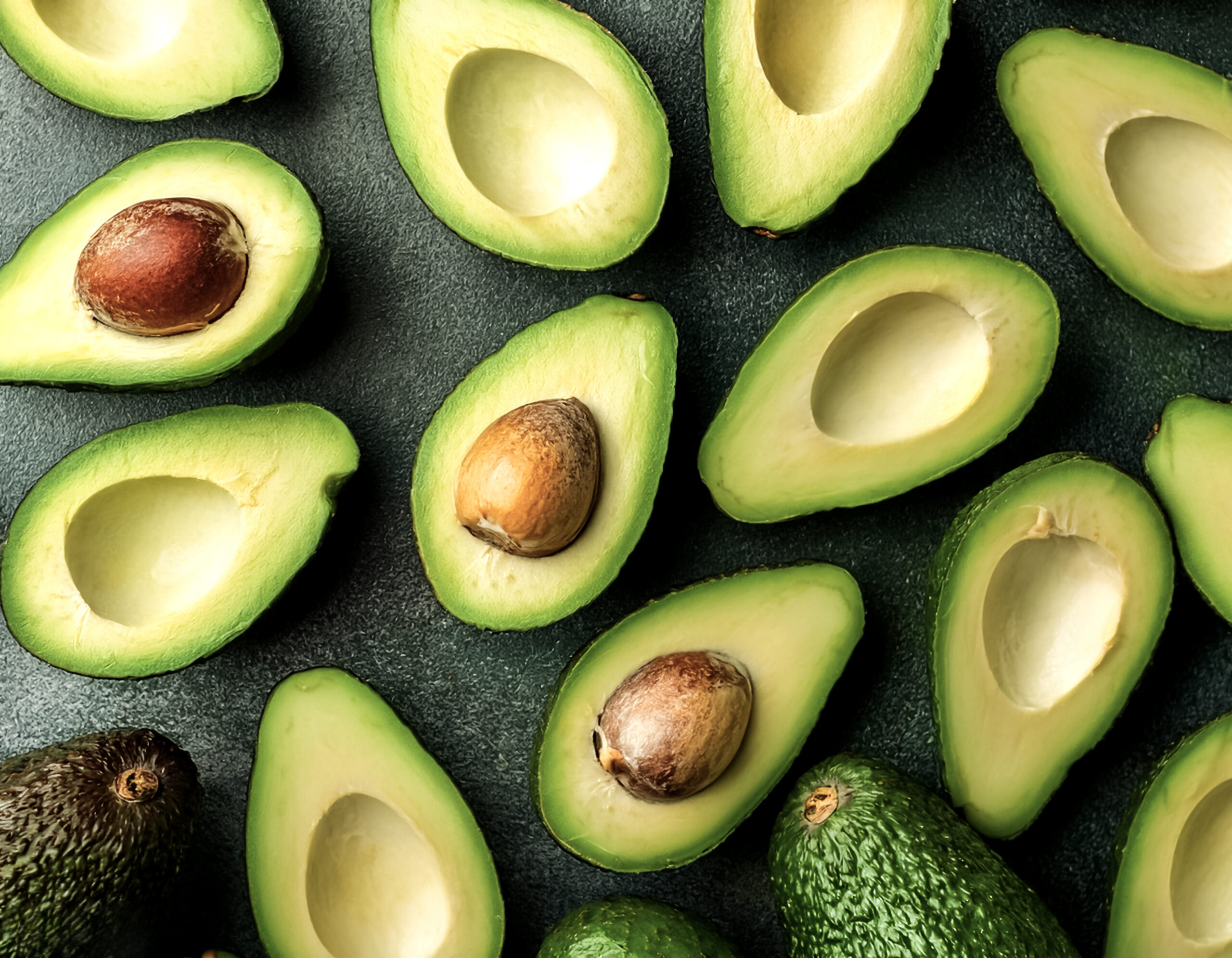 Overhead view of Fresh Ripe avocado halves food summer background. healthy food background