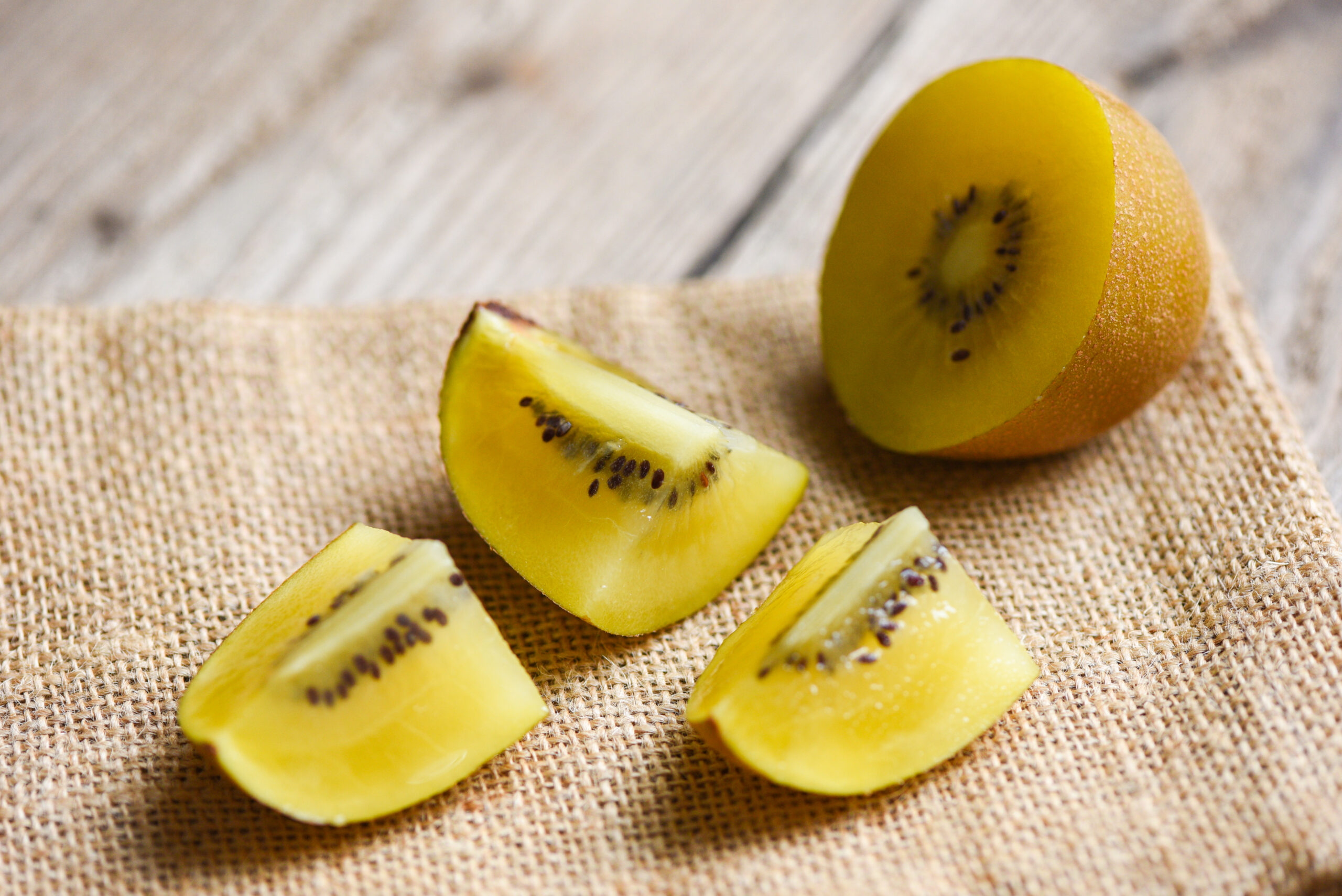 Kiwi slice on sack , Close-up of yellow kiwi fruit