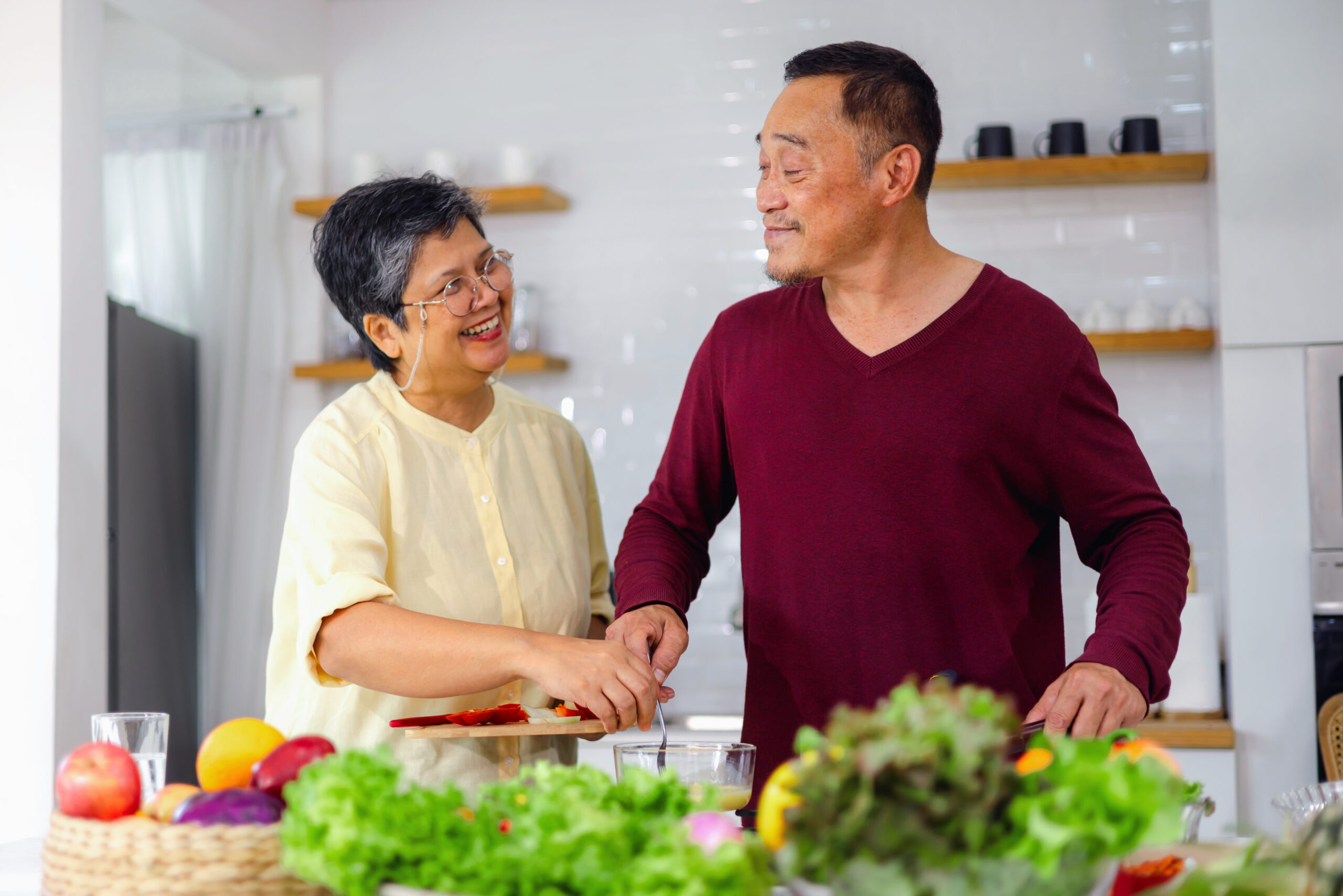 elderly couple cooking in the kitchen